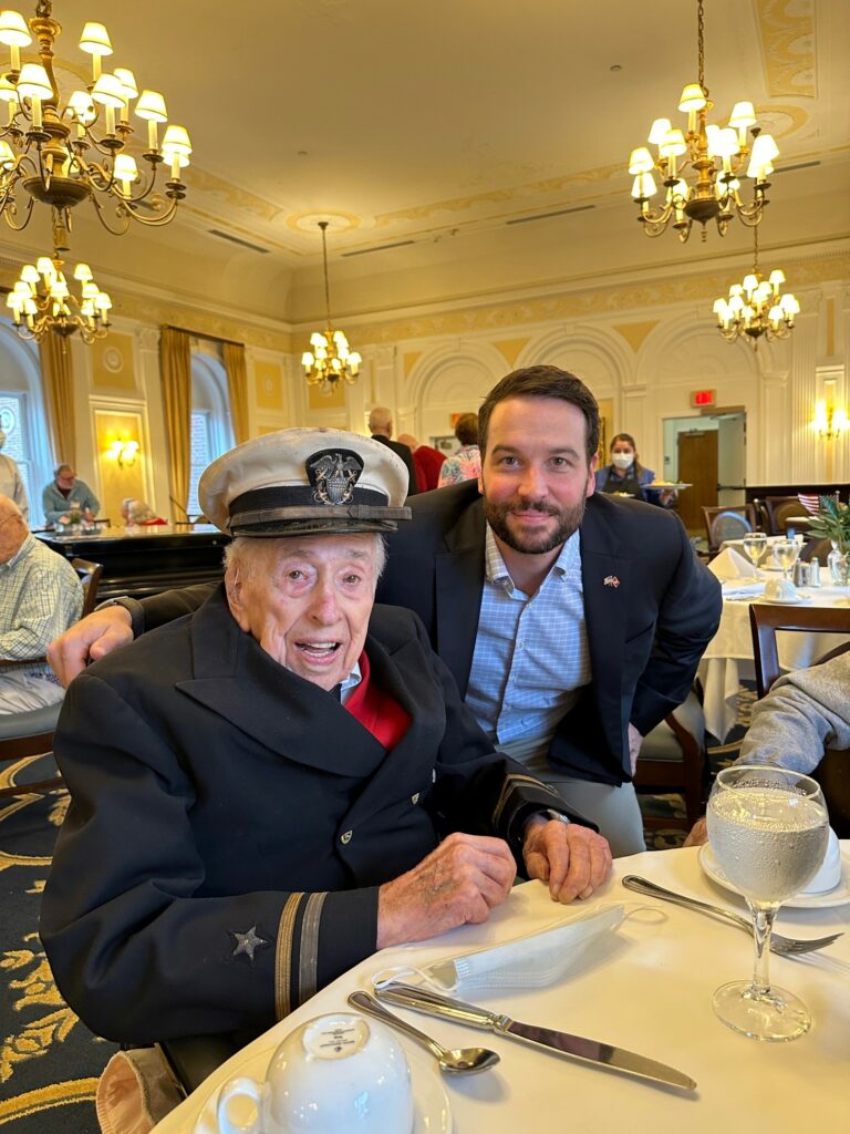 (PHOTO: Grant Savage with Osborn resident Leon Starr, a 104-year old World War II veteran. Starr attended Harvard when he returned from the war and was in the same graduating class as John F. Kennedy. November 11, 2022.)