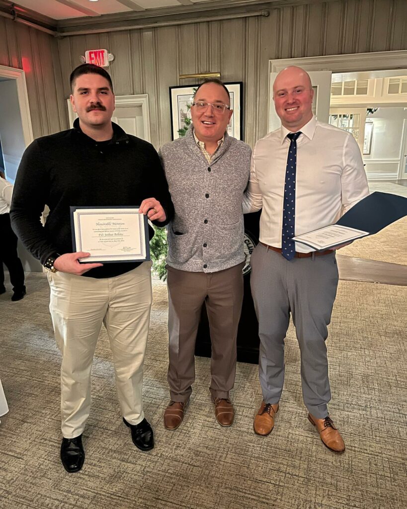 (PHOTO: Rye Police Officer Joshua Belloise, PBA President Rye Police Detective Gabe Caputo and Rye Police Officer Dan Dabrowski at the Rye PBA holiday dinner on December 15, 2022.)