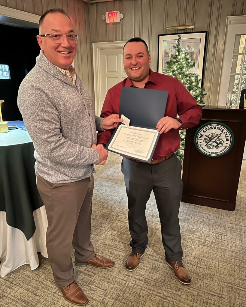 (PHOTO: PBA President Rye Police Detective Gabe Caputo and Rye Police Officer Justin Kenney at the Rye PBA holiday dinner on December 15, 2022.)