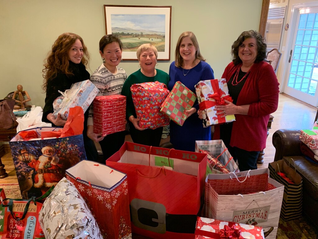 (PHOTO: Gathering gifts for the Children’s Philanthropy of the Woman’s Club of Rye's Holiday Angels gift program (left to right, Samantha Tollinchi, Christine Groves, Mary Kelly Kehoe, Laura Slack, Jeanine Sestito).)