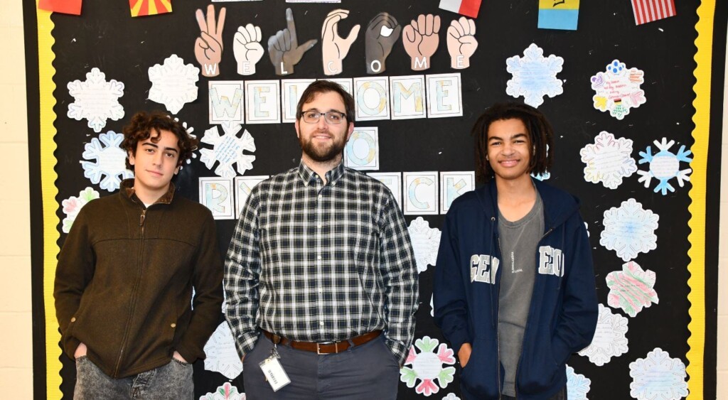 (PHOTO: Rye Neck senior Eduardo Ruigomez, Rye Neck High School Social Studies Teacher Shawn Tedrow and Rye Neck senior James Fall.)