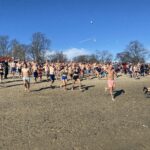 (PHOTO: The 21st Annual Polar Bear Plunge was held on January 1st, 2023 in Rye Town Park and honored Norbert Galligan.)