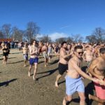 (PHOTO: The 21st Annual Polar Bear Plunge was held on January 1st, 2023 in Rye Town Park and honored Norbert Galligan.)