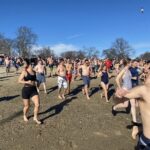 (PHOTO: The 21st Annual Polar Bear Plunge was held on January 1st, 2023 in Rye Town Park and honored Norbert Galligan.)