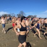 (PHOTO: The 21st Annual Polar Bear Plunge was held on January 1st, 2023 in Rye Town Park and honored Norbert Galligan.)