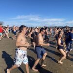 (PHOTO: The 21st Annual Polar Bear Plunge was held on January 1st, 2023 in Rye Town Park and honored Norbert Galligan.)