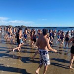 (PHOTO: The 21st Annual Polar Bear Plunge was held on January 1st, 2023 in Rye Town Park and honored Norbert Galligan.)