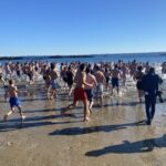 (PHOTO: The 21st Annual Polar Bear Plunge was held on January 1st, 2023 in Rye Town Park and honored Norbert Galligan.)