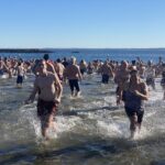 (PHOTO: The 21st Annual Polar Bear Plunge was held on January 1st, 2023 in Rye Town Park and honored Norbert Galligan.)