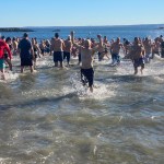 (PHOTO: The 21st Annual Polar Bear Plunge was held on January 1st, 2023 in Rye Town Park and honored Norbert Galligan.)