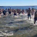 (PHOTO: The 21st Annual Polar Bear Plunge was held on January 1st, 2023 in Rye Town Park and honored Norbert Galligan.)