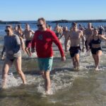 (PHOTO: The 21st Annual Polar Bear Plunge was held on January 1st, 2023 in Rye Town Park and honored Norbert Galligan.)