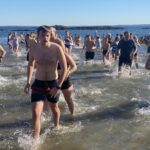 (PHOTO: The 21st Annual Polar Bear Plunge was held on January 1st, 2023 in Rye Town Park and honored Norbert Galligan.)