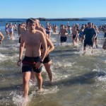 (PHOTO: The 21st Annual Polar Bear Plunge was held on January 1st, 2023 in Rye Town Park and honored Norbert Galligan.)