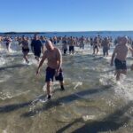 (PHOTO: The 21st Annual Polar Bear Plunge was held on January 1st, 2023 in Rye Town Park and honored Norbert Galligan.)