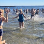 (PHOTO: The 21st Annual Polar Bear Plunge was held on January 1st, 2023 in Rye Town Park and honored Norbert Galligan.)