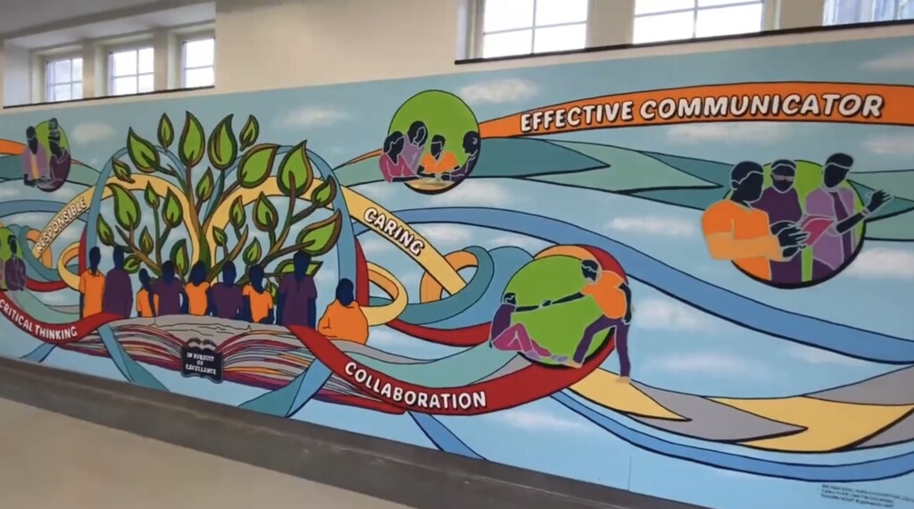 (PHOTO: Artist Joe Pimentel worked with the Rye High School Garnets class to create a mural at the High School. The mural represents the Rye Commitment and what it means to students.)