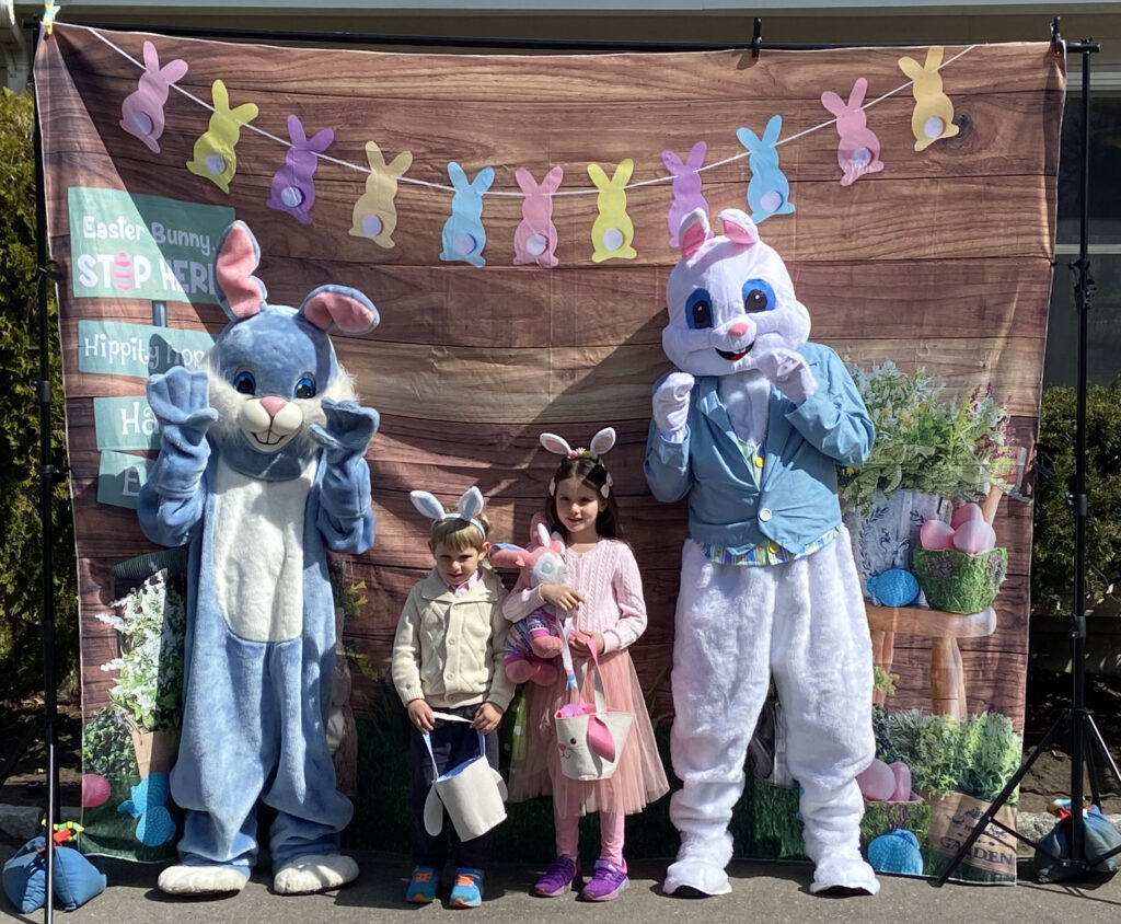 (PHOTO: Rye Rec's Hoppity the Bunny appears with his "friend" bunny from Rye FD along with two of the 500 or so 2023 egg hunters.)