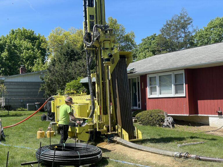 (PHOTO: Dandelion Energy uses small, nimble rigs to drill the hole for a geothermal ground loop in a customer's backyard.)