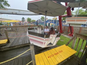 (PHOTO: New Playland General Manager Jeff Davis and Westchester Deputy County Executive Ken Jenkins sit together to enjoy a “first ride” on the Playland Ferris wheel on Saturday just after the park opened at 11am.)