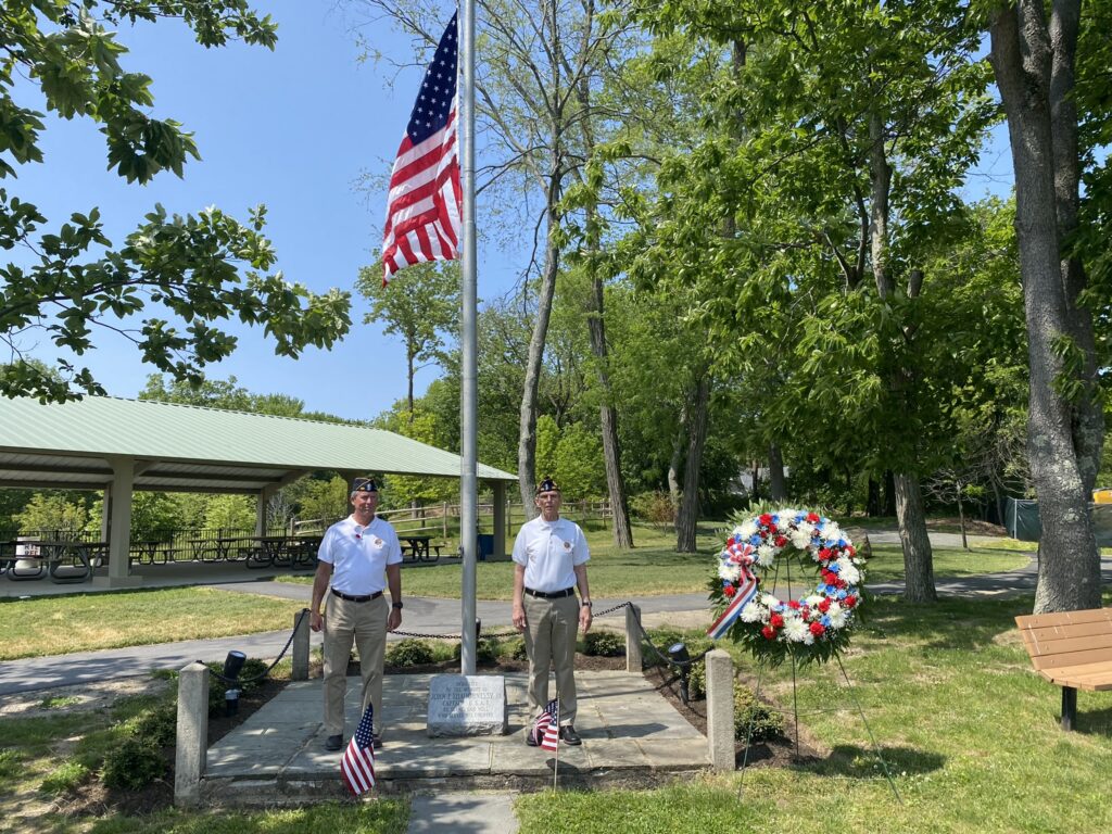 (PHOTO: Finance Officer and Adjutant Tim Moynihan and Commander Frederick de Barros of the American Legion Post 128 honored the life of John F. Shaughnessy Jr. on Memorial Day 2023.)