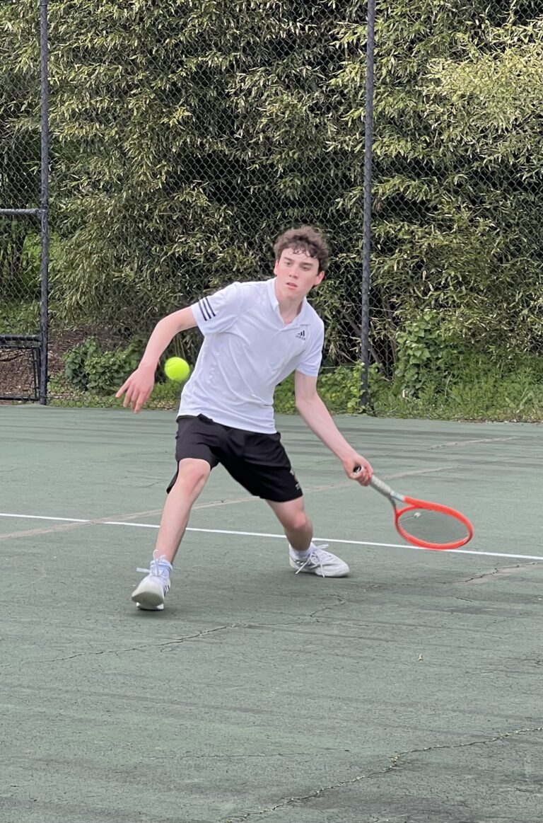 (PHOTO: 2023 Rye Boys Varsity team member Ty Bibas with a strong forehand.)