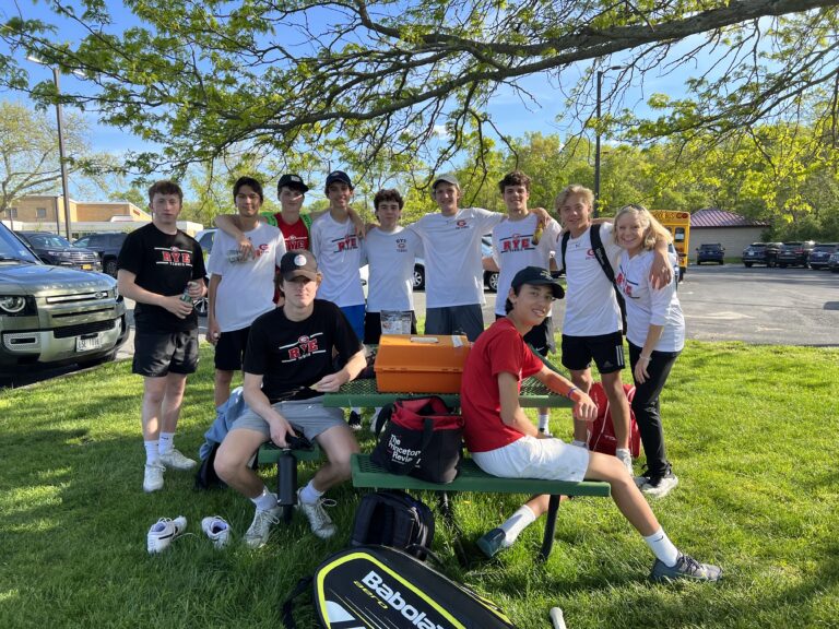 (PHOTO: The Rye Boys Varsity Tennis team on Monday in Harrison. Happy team, happy coach! A beautiful May day.)