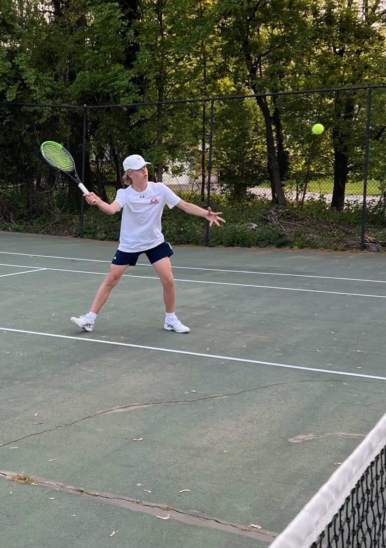 (PHOTO: 2023 Rye Varsity Tennis team 8th grader Filip Glitterstam showing steady net play.)