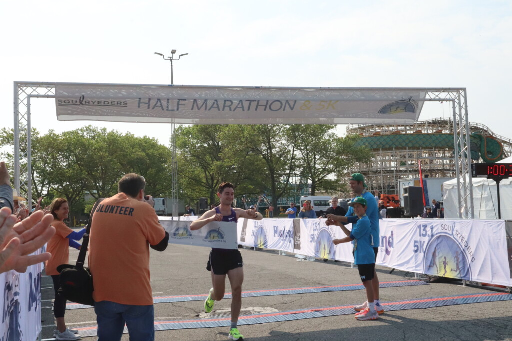 (PHOTO: Soul Ryeders inaugural half marathon and 5K run was held on Sunday, May 21, 2023. Half marathon male winner Peter Schulter (1:12:30 run time) at the finish line.)