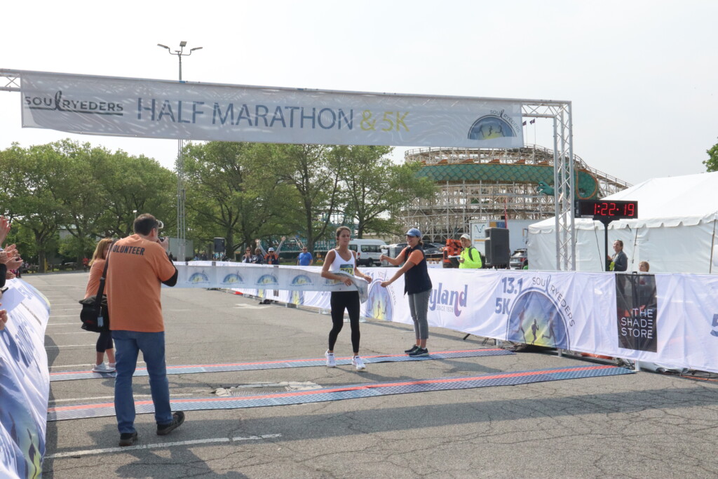 (PHOTO: Soul Ryeders inaugural half marathon and 5K run was held on Sunday, May 21, 2023. Half marathon female winner Liza Gellerman (1:34:18 run time) at the finish line.)