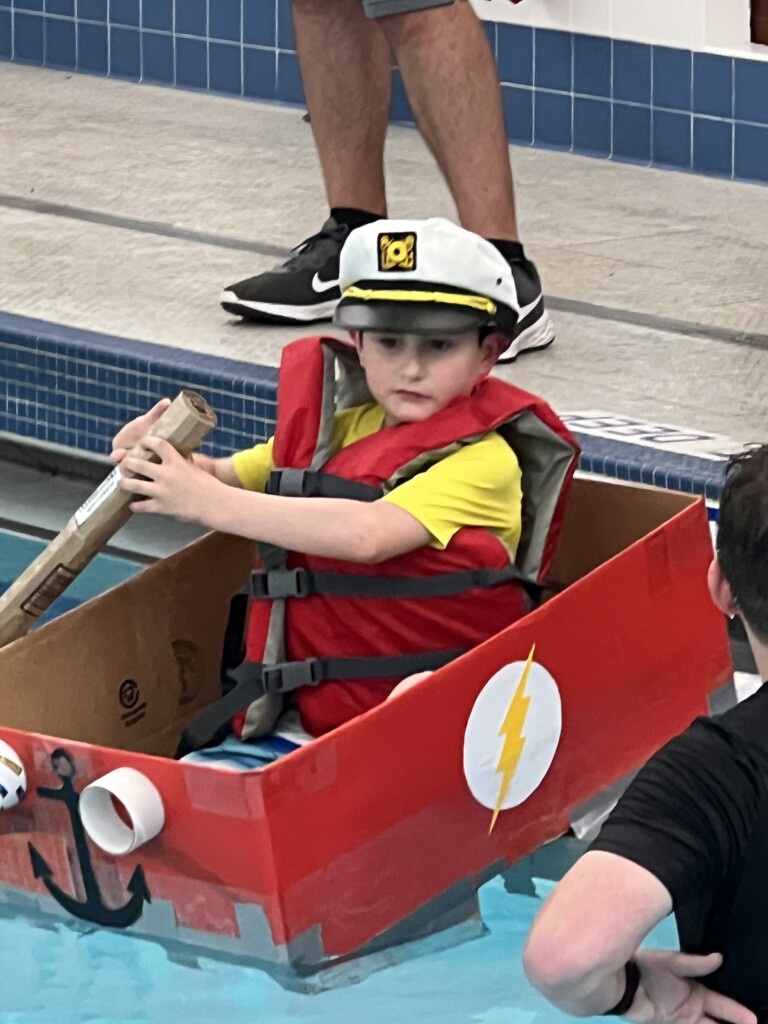 (PHOTO: The 7th Annual Rye YMCA Cardboard Boat Regatta best design winner Kirian Ranado.)