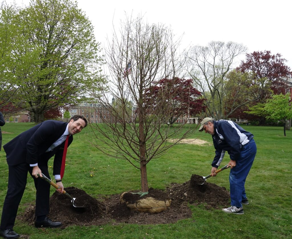 (PHOTO: (L-R): The Osborn President & CEO Matthew Anderson and Osborn Sterling Park Independent Living resident John DiElsi planting a Bald Cypress tree, Taxodium distichum, a deciduous conifer in the family Cupressaceae last Friday, April 28, 2023 for Arbor Day.)
