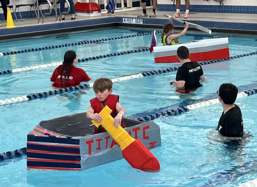 (PHOTO: The 7th Annual Rye YMCA Cardboard Boat Regatta. We did not say it - he did - the Titanic!)