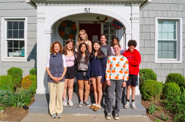 (PHOTO: The crew that attended the meeting posing on the front steps of the Rye Arts Center (from left to right) Laura Anechiarico, Kiki Keith, Marra Storey (behind), Cami Leon Bolivar, Ella Kim, Isabella Biancucci (behind), Valentina Perdomo (behind), Sally Eggers, and Noah Adler.)