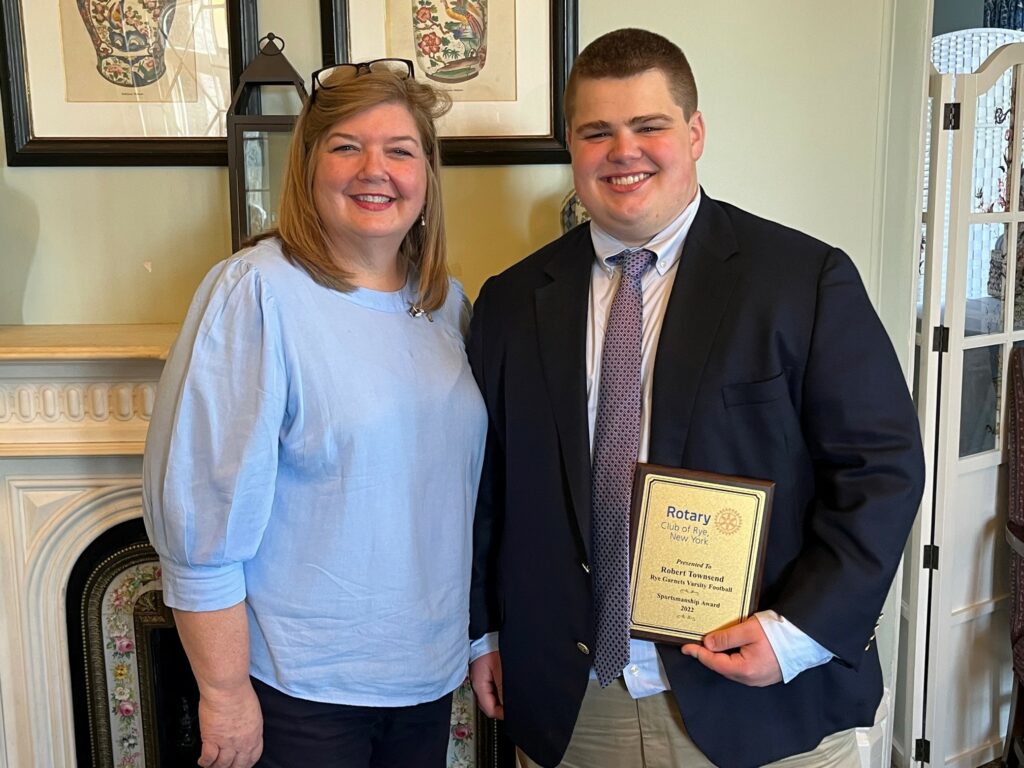 (PHOTO: Rye Varsity Football player Robert Townsend with Rye Rotary President Michele Thomas at the Rye Rotary sportsman's lunch on April 21, 2023.)