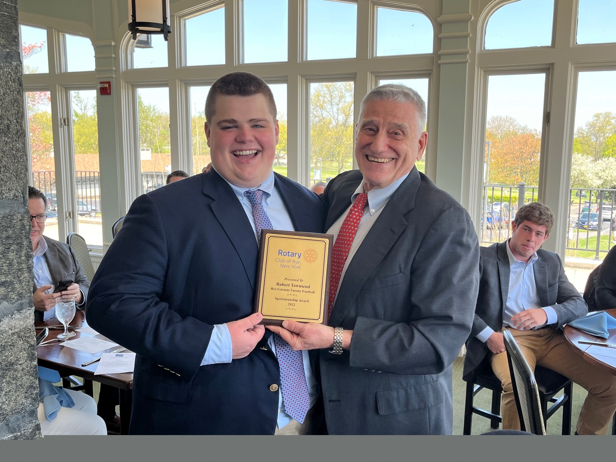 (PHOTO: Rye Varsity Football player Robert Townsend with Rye Football Coach Dino Garr at the Rye Rotary sportsman's lunch on April 21, 2023.)
