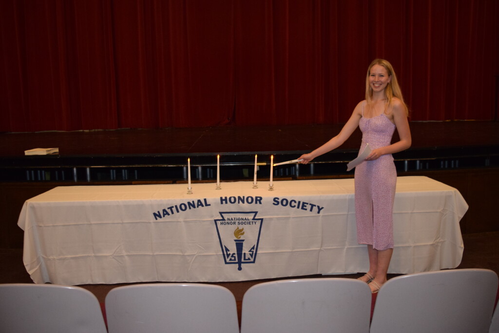 (PHOTO: For the National Honor Society (NHS) ceremony, Piper Tenney lit the Candle of Character.)