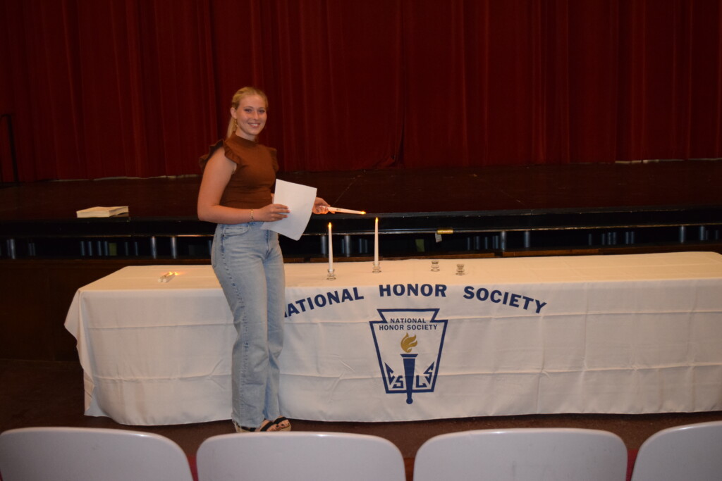 (PHOTO: For the National Honor Society (NHS) ceremony, Jillian Brensilver lit the Candle of Leadership.)