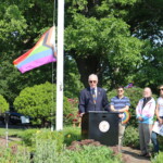 (PHOTO: Town of Rye Supervisor Gary Zuckerman speaks to the crowd at the Pride flag raising in Rye Town Park on Saturday, June 10, 2023. Credit: Sierra Desai.)