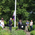 (PHOTO: Rye City Council member Lori Fontanes speaks at the Pride flag raising in Rye Town Park on Saturday, June 10, 2023. Credit: Sierra Desai.)