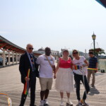 (PHOTO: (from left to right) Town of Rye Supervisor Gary Zuckerman, Congressman Jamaal Bowman, Town of Rye Councilwoman Pam Jaffee, and pRYEde's Amanda Timchak pose at the halfway point of the Pride parade on the PLayland boardwalk on Saturday, June 10, 2023. Credit: Sierra Desai.)