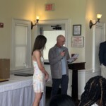 (PHOTO: Cassidy Pagen receives her student-athlete of the month certificate from Varsity Girls' Tennis Coach Tony Campbell.)