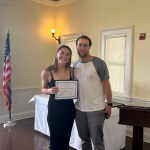 (PHOTO: Mackenzie Chimento receives a student-athlete of the month certificate from Varsity Track & Field coach Kevin Murphy.)