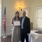 (PHOTO: Ashley Kessner receives a student-athlete of the month certificate from Varsity Softball coach Alex Tejera.)