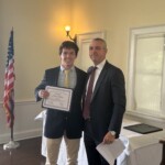 (PHOTO: Dan Dalton receives a student-athlete of the month certificate from Varsity Rugby coach Jim O'Hara.)