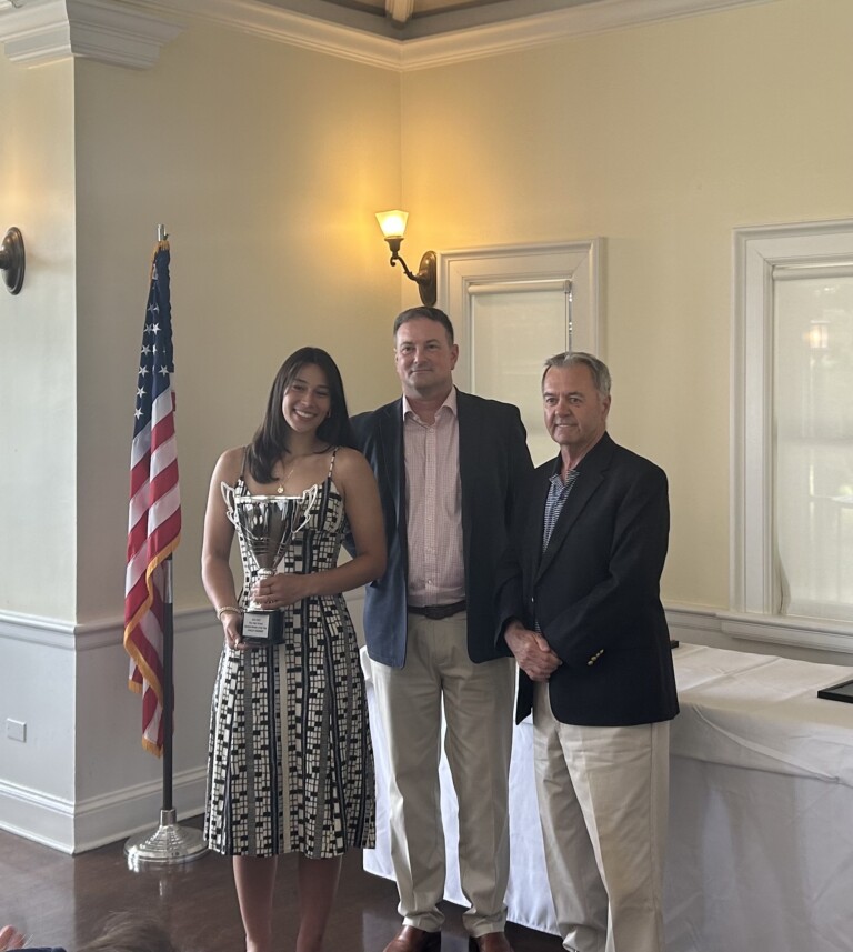 (PHOTO: Ashley Kessner receives her Lions Club Scholar Athlete of the Year award from Lions Club President Brian Jackson and Lion Tommy Maloney.)