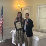 (PHOTO: Lions Club Athlete of the Year Ashley Kessner receives a proclamation from City of Rye Mayor Josh Cohn.)