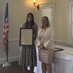 (PHOTO: Lions Club Athlete of the Year Ashley Kessner receives a proclamation from Westchester County Legislator Catherine Parker.)