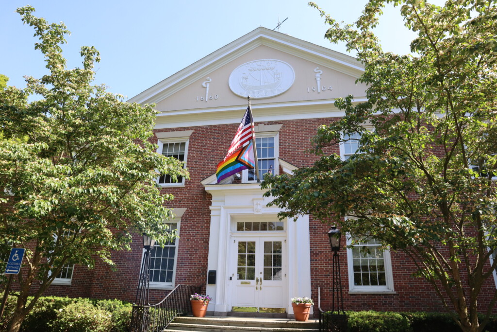 (PHOTO: The Pride Flag raised over City Hall. Credit: Sierra Desai.)