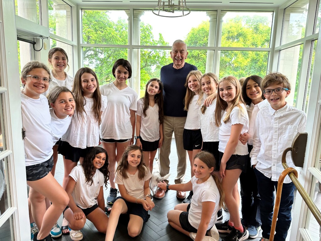 (PHOTO: Osborn Resident Jack Savage with Osborn schoolchildren)